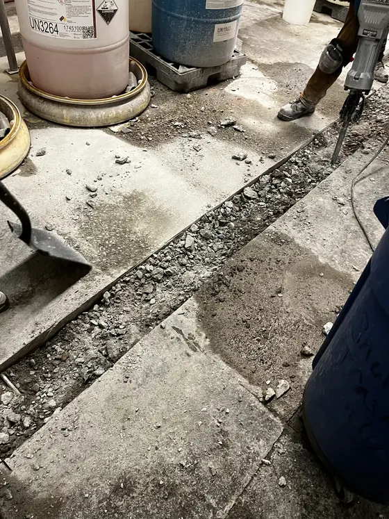 Exposed underground line beside an excavation
