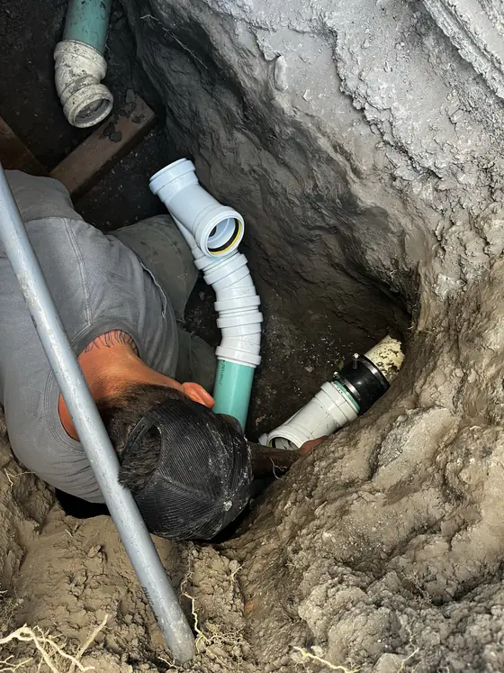 Exposed underground line in a narrow excavation