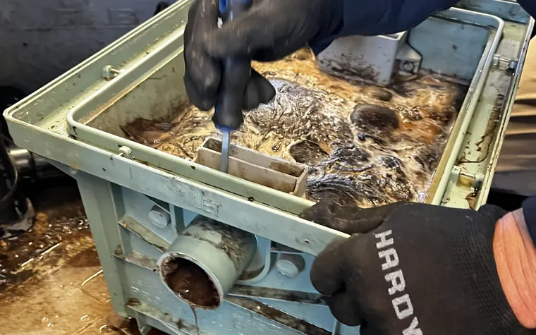 Grease interceptor being serviced