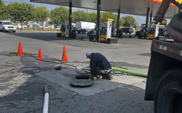 Act Now Pros crew working a commercial forecourt line